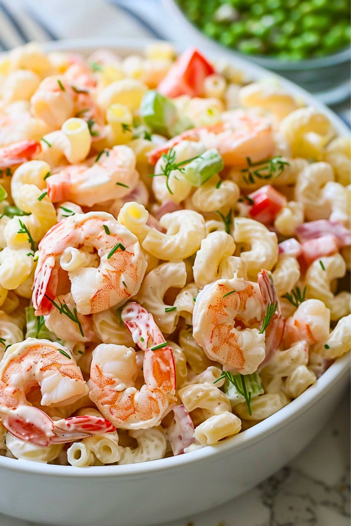 Shrimp pasta salad in a white bowl 