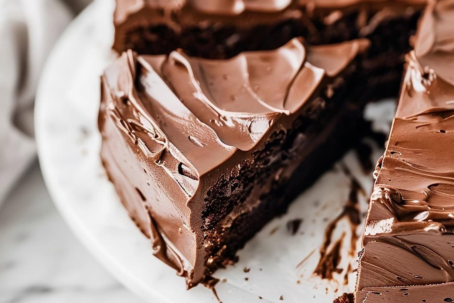 Portion sliced Chocolate Truffle Cake on a cake tray.