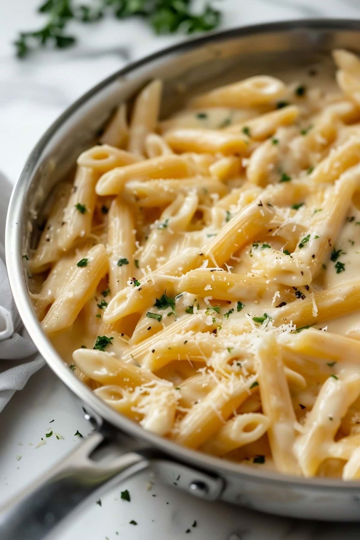 Cream Cheese Pasta tossed in a skillet pan.