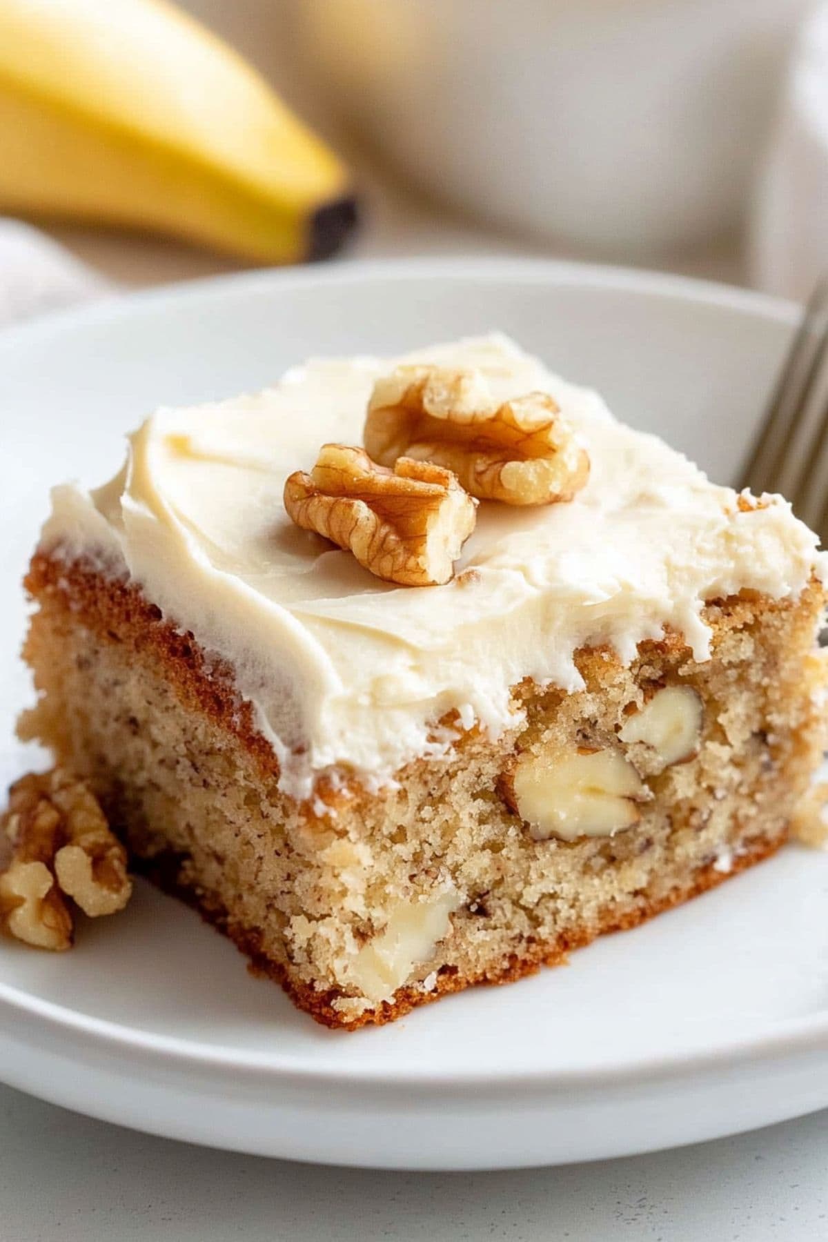 Banana Bread bar with Brown Butter Frosting on a plate