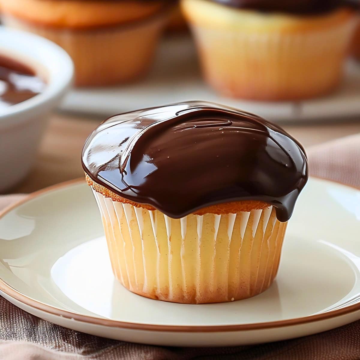 Boston Cream Pie Cupcake in a white plate.