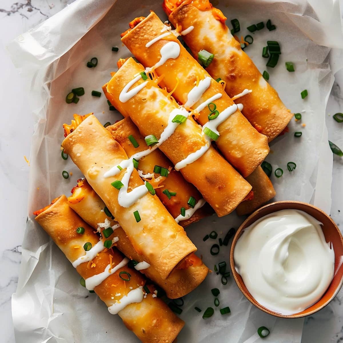 Buffalo Chicken Taquitos Served with Dip.