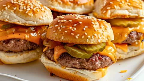 Cheeseburger sliders in a baking pan.