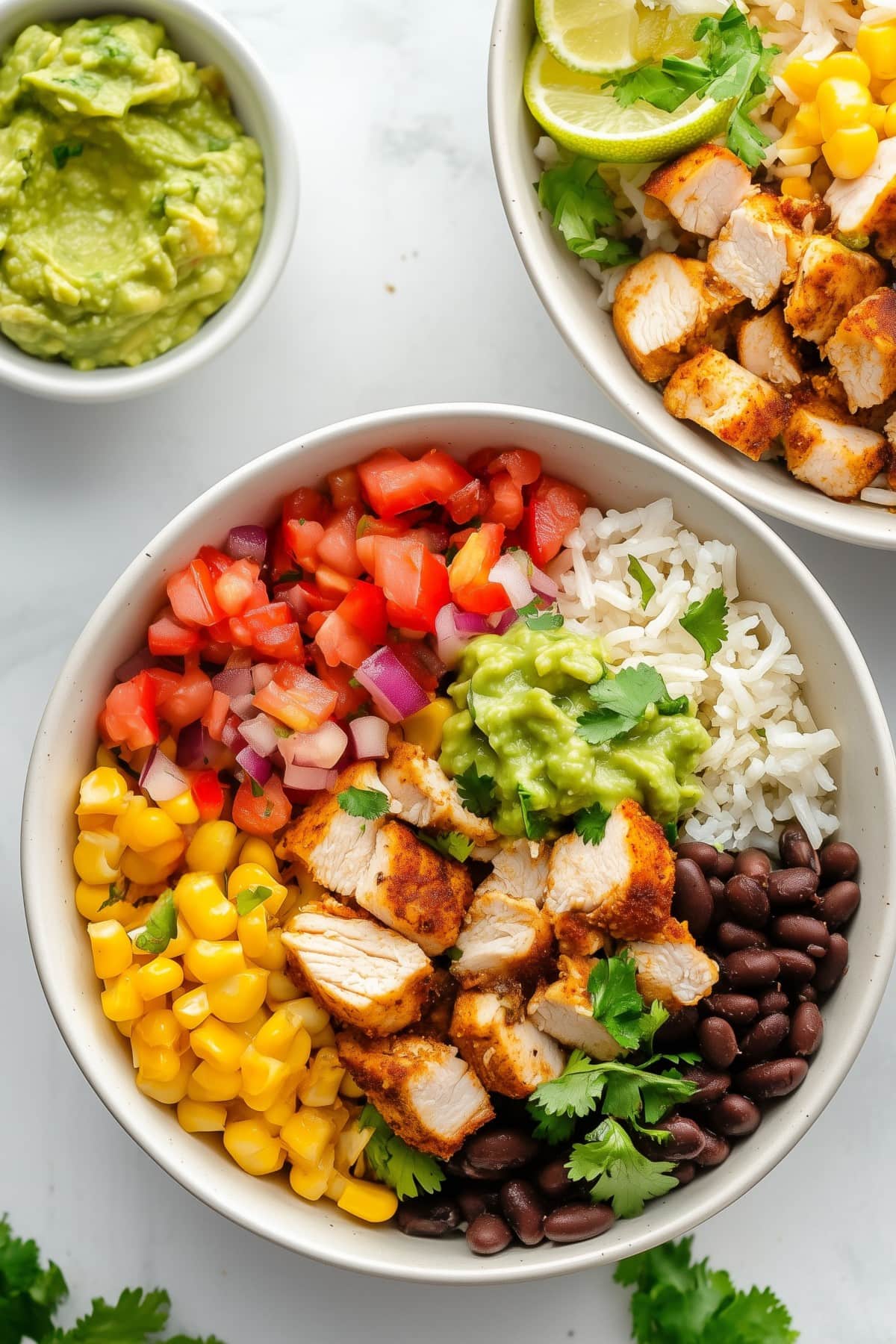 Chipotle Burrito Bowl with Bite-Sized Chicken, Rice, Salsa, Corn, Beans, and Guacamole, Top View
