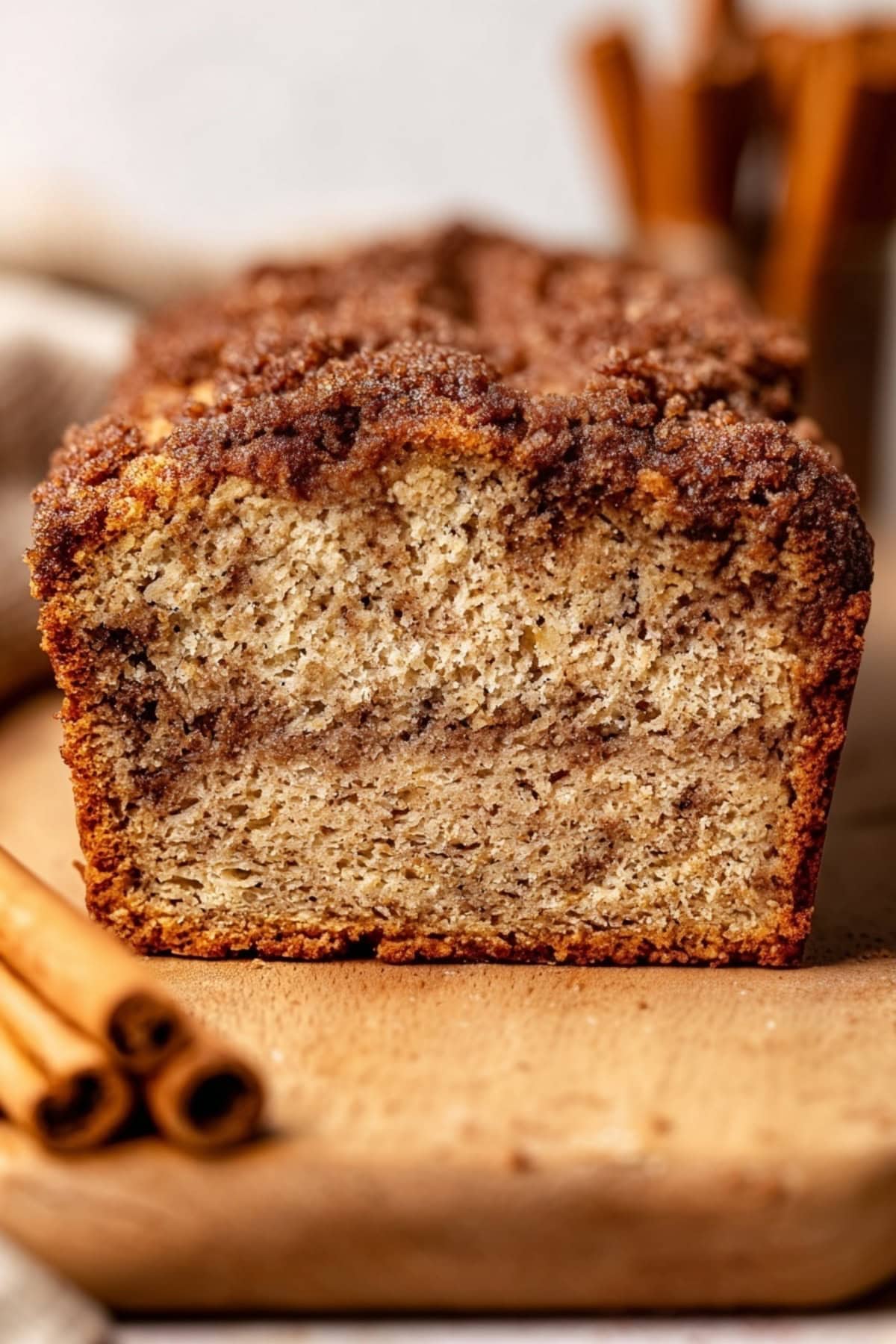 Close-up of cinnamon crunch banana bread in a wooden board.