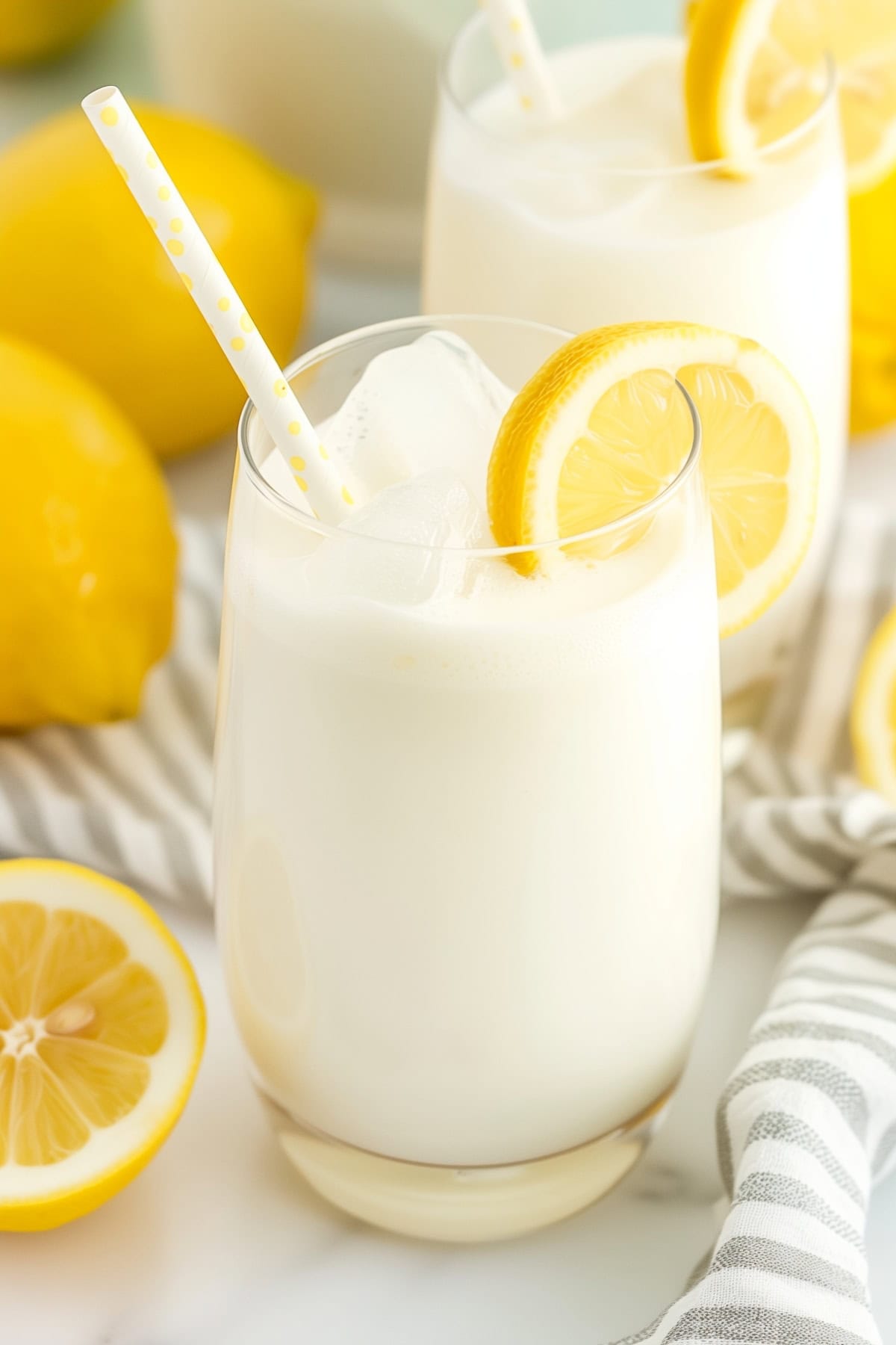 Hearty creamy lemonade, served in a chilled glass with a straw and lemon slice garnish.