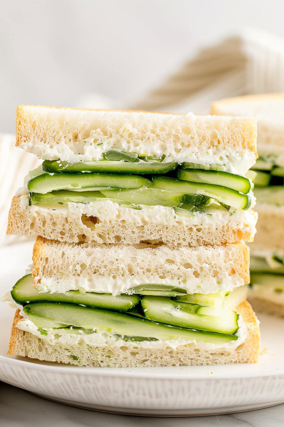 Savory cucumber sandwiches with herbed cream cheese filling.