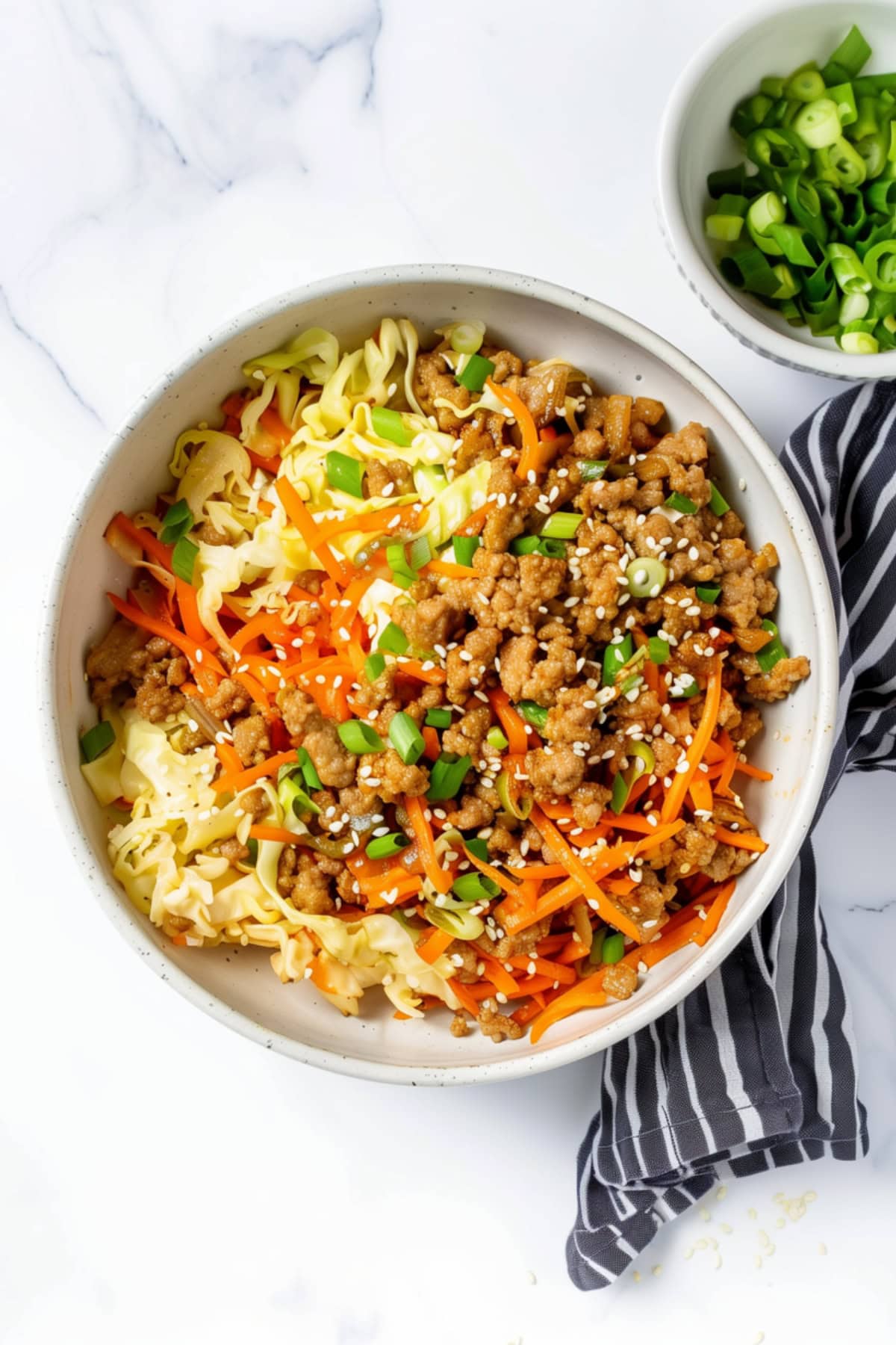 Quick egg roll in a bowl with carrots, cabbage and hoisin sauce.