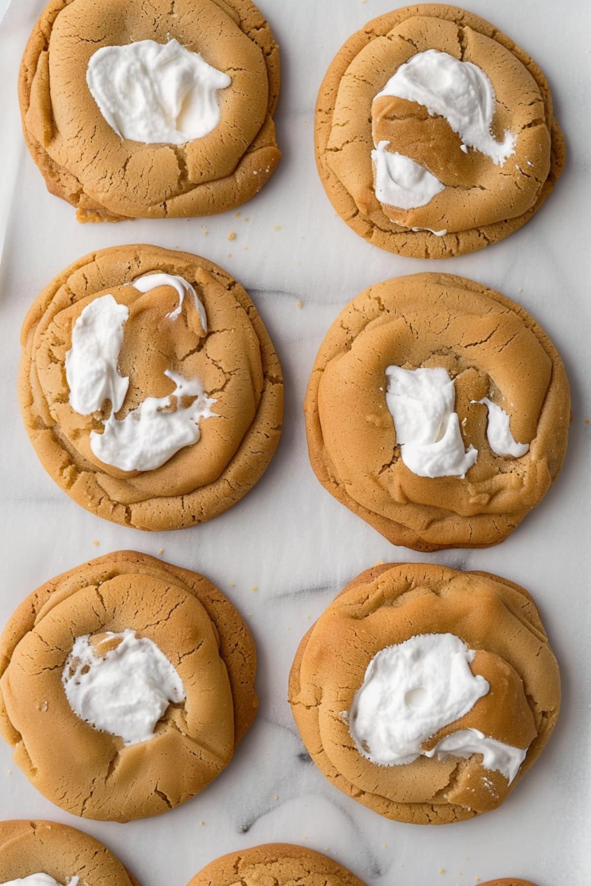 Delicious fluffernutter cookies, featuring a golden-brown exterior and a soft, gooey marshmallow fluff.