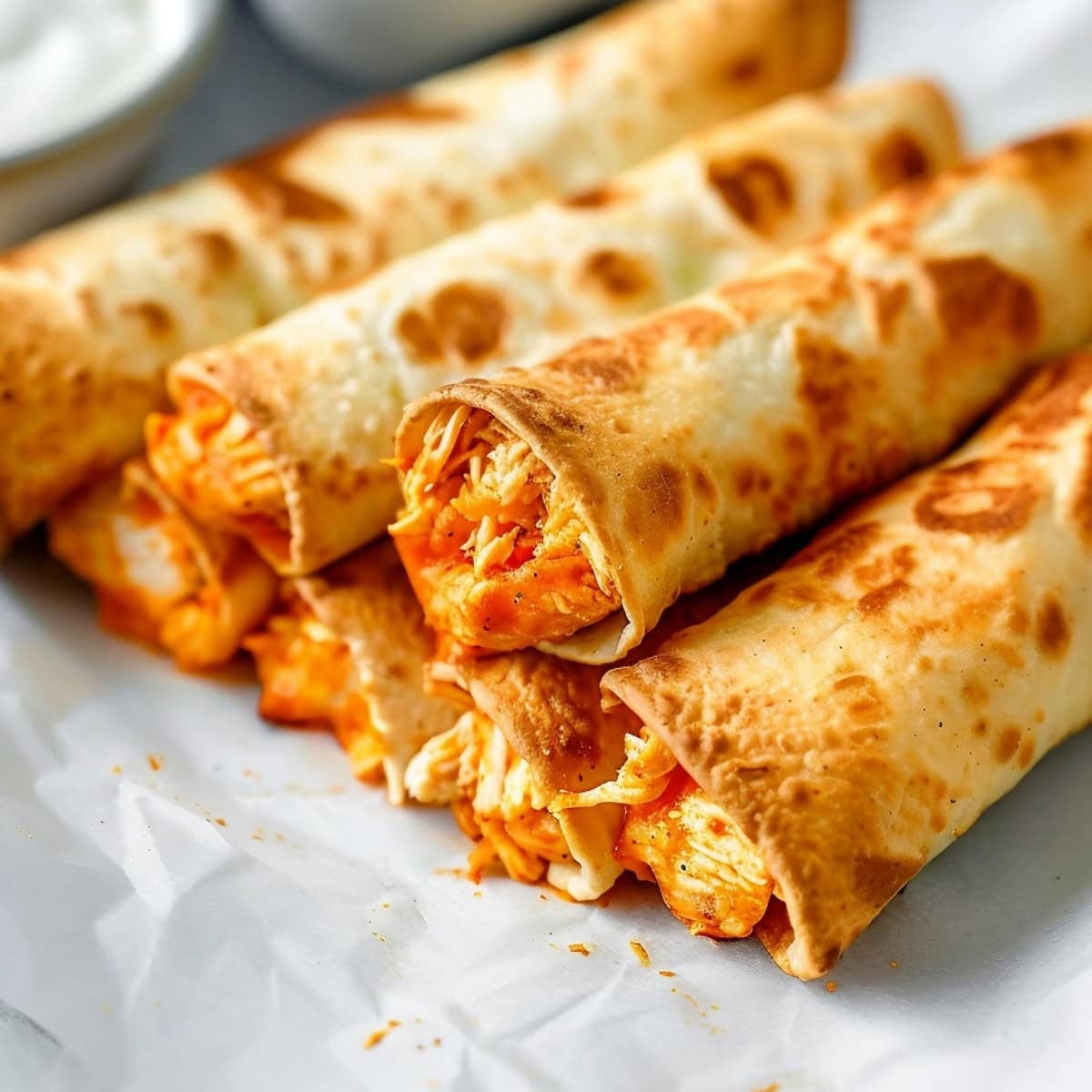 Flavorful taquitos packed with cheesy buffalo chicken.