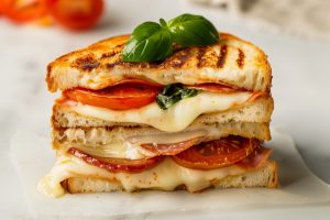 Flavorful and delicious Italian grilled cheese sandwich with pepperoni and tomatoes.