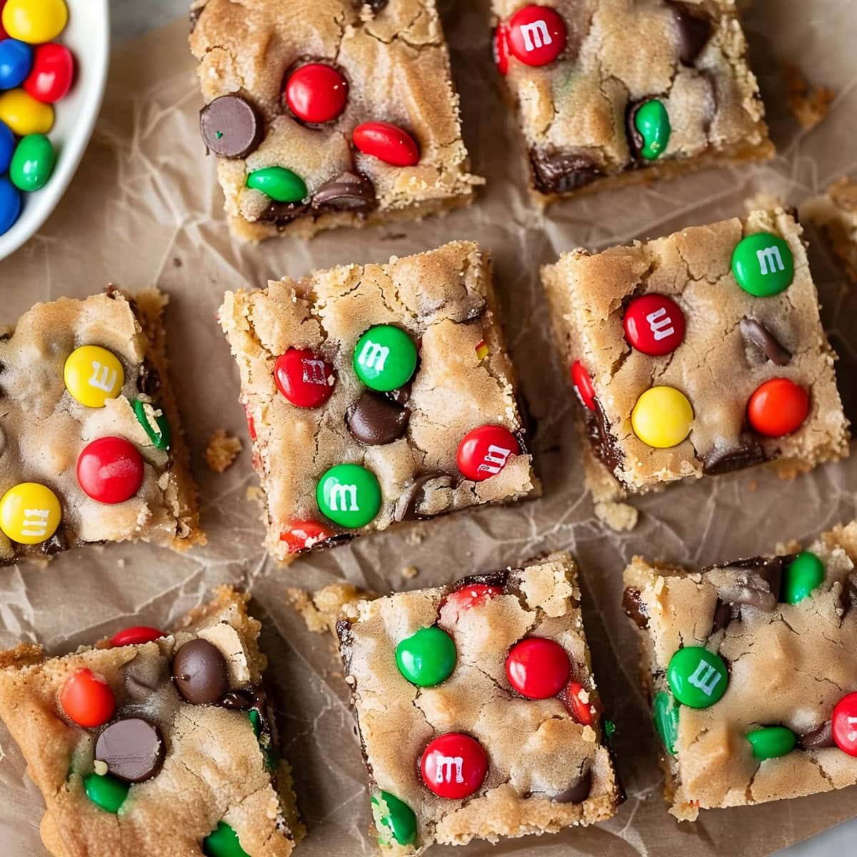 Hearty M&M cookie bars, featuring a rich, buttery flavor and plenty of colorful candy pieces.