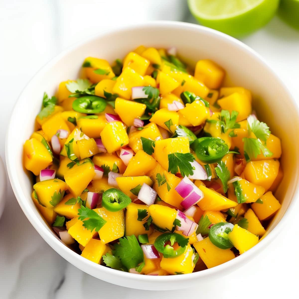 Vibrant mango salsa, with red onions, jalapeños, and cilantro