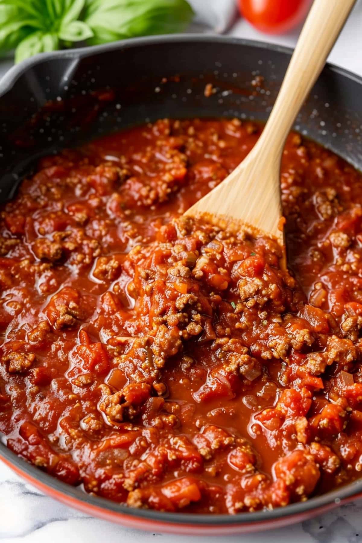 Tiktok spaghetti meat sauce in a black skillet.