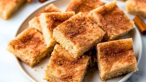 Snickerdoodle bars arranged in a white plate.