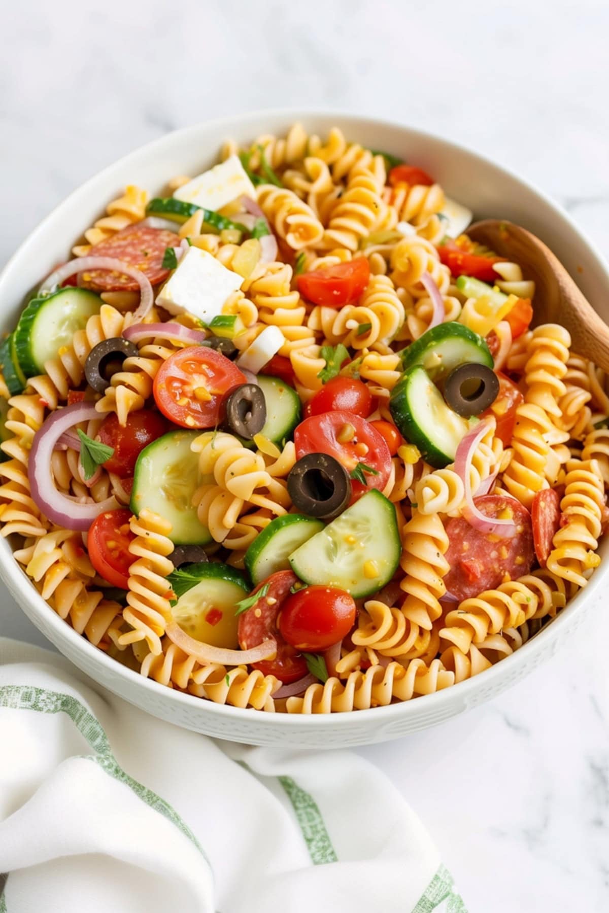 Colorful and flavorful supreme pasta salad in a bowl.