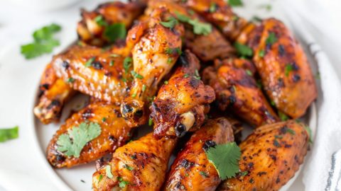 Yogurt marinated baked chicken wings in a plate.