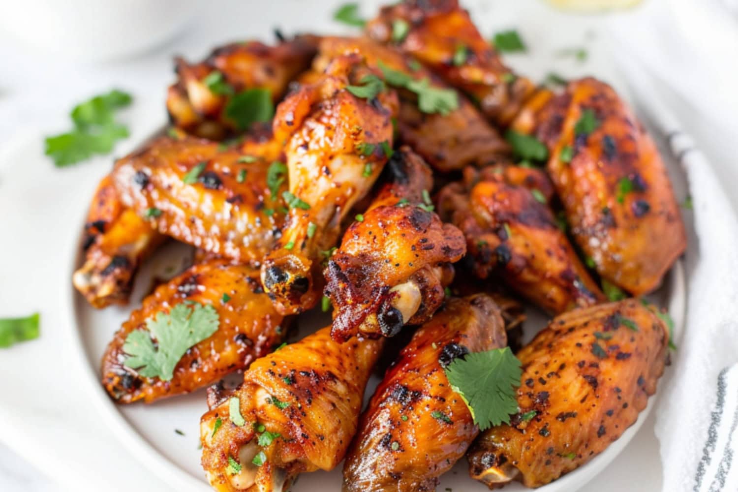 Yogurt marinated baked chicken wings in a plate.