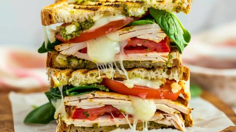 Turkey pasta sandwich in a wooden board.