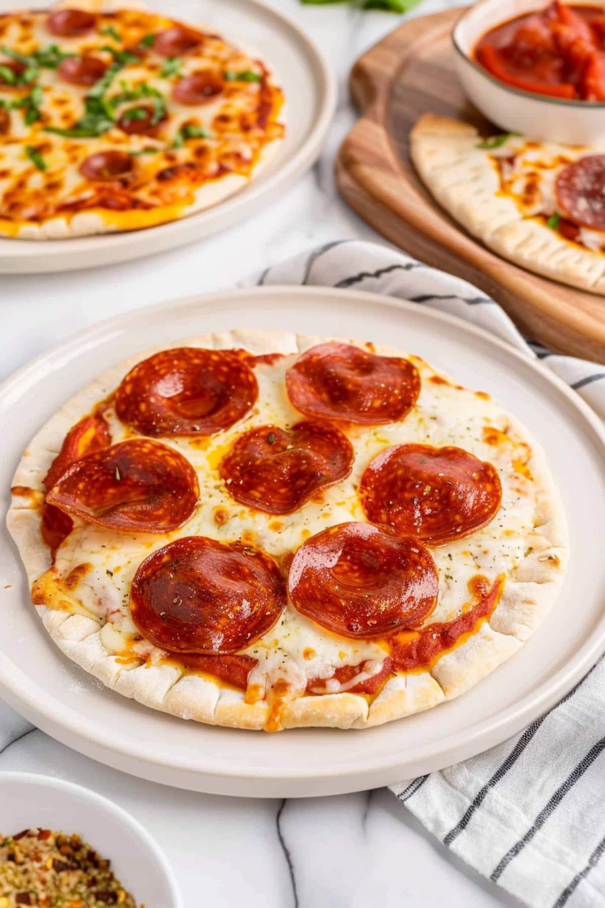 Delicious pita pizza with pepperoni and melted cheese.