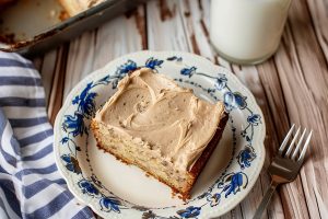 Banana Bread with Brown Butter Frosting square slice on a plate.