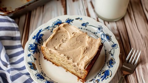 Banana Bread with Brown Butter Frosting square slice on a plate.