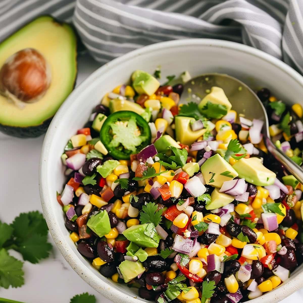 Hearty black bean and corn salad, perfect as a side dish or a light meal, bursting with flavors.