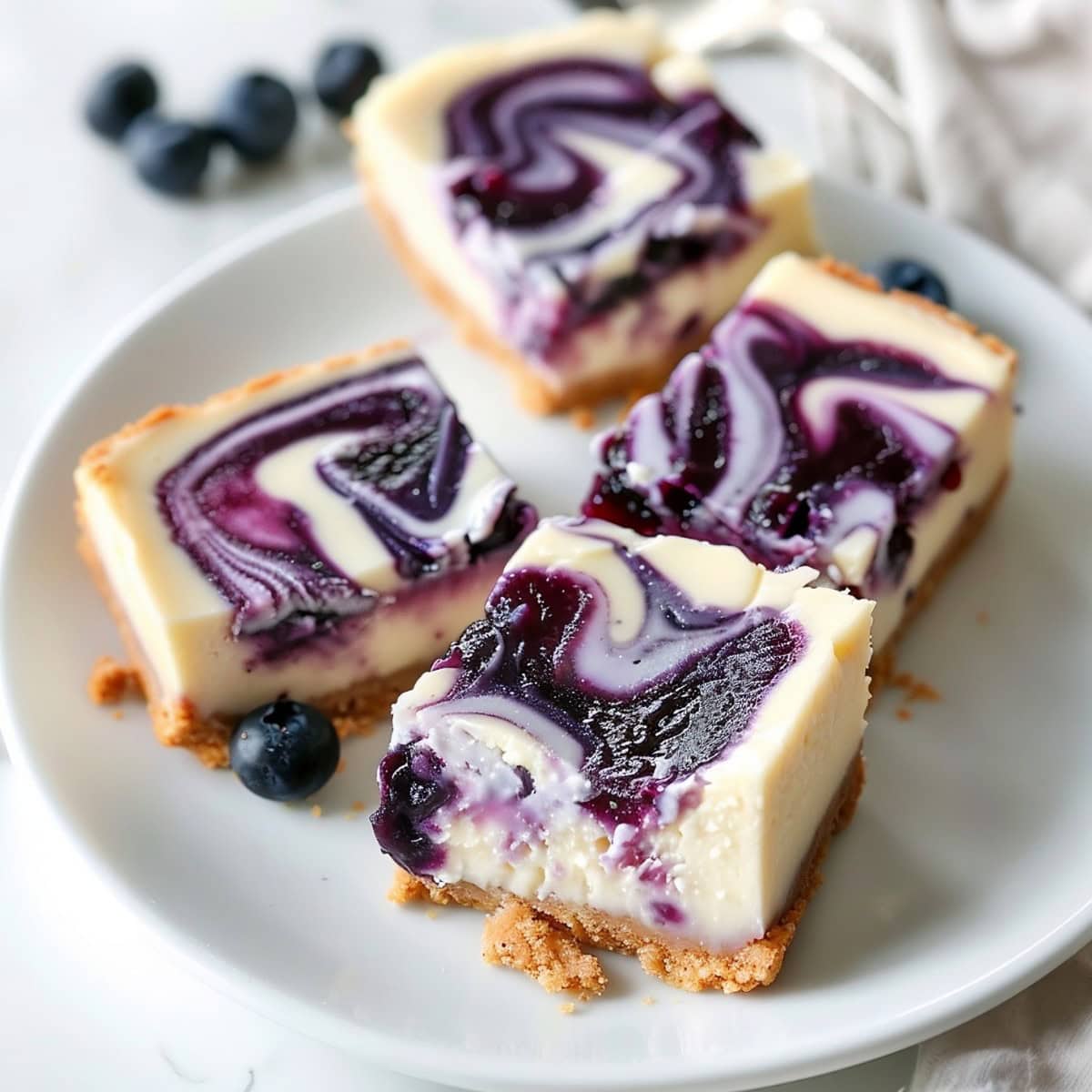 Blueberry Cheesecake Bars on a Plate