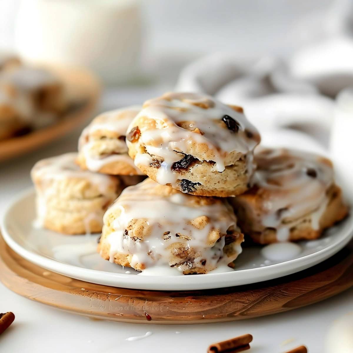 Cinnamon Raisin Biscuits Stacked on a White Plate