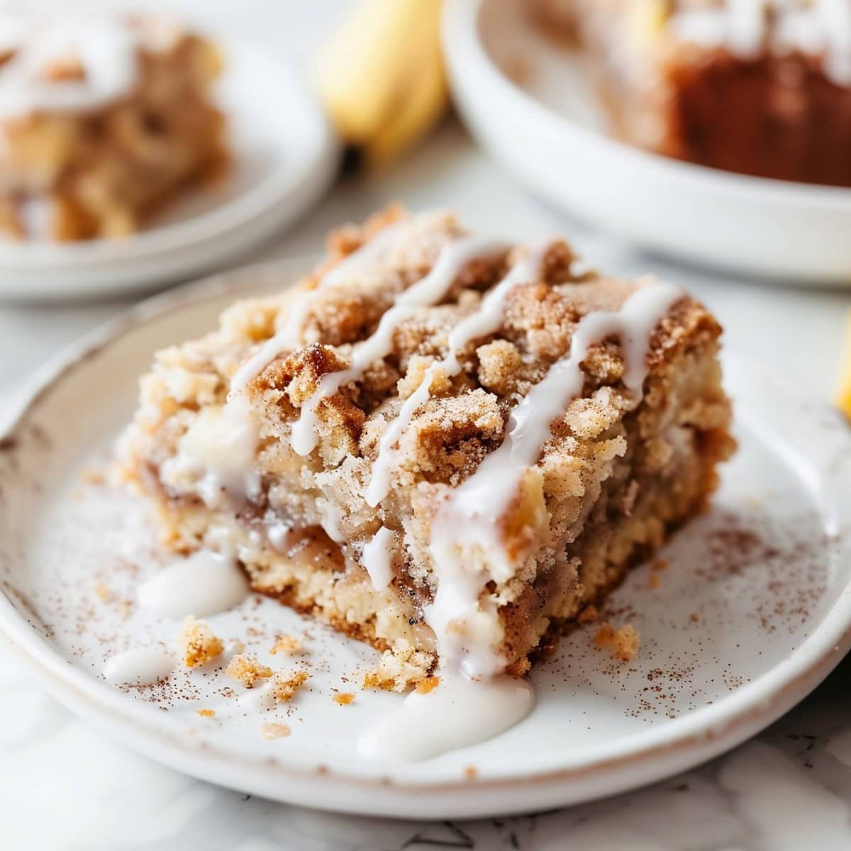 Coffee Cake Banana Bread on a plate with glaze