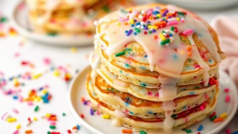 Funfetti pancakes served on a white plate