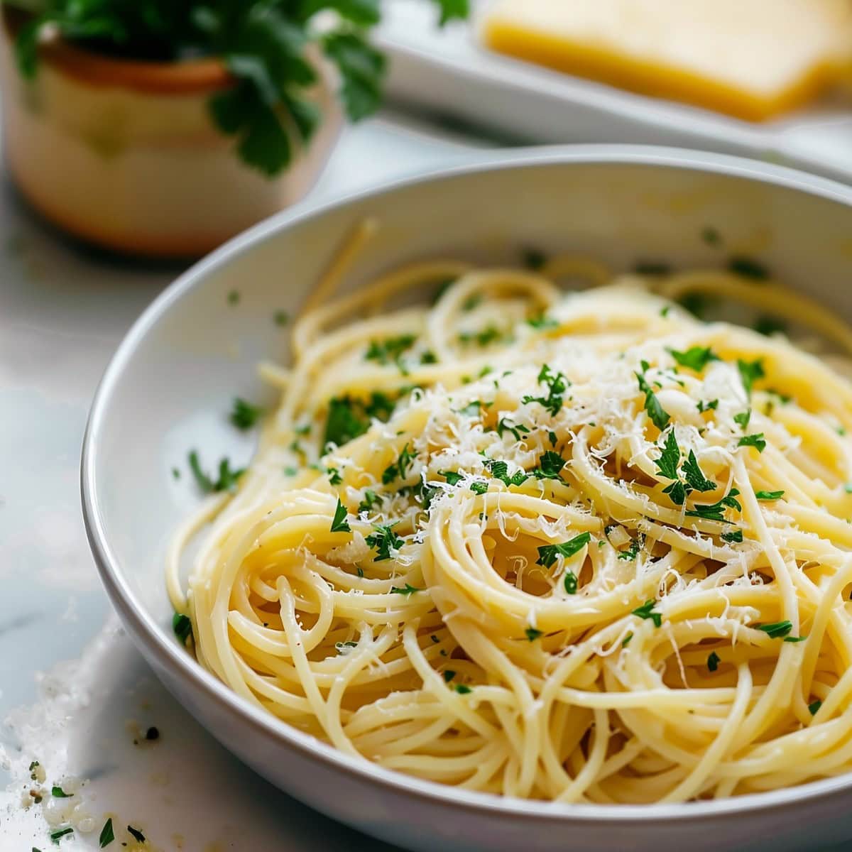 Hearty garlic parmesan pasta, showcasing perfectly cooked noodles, garnished with parsley.