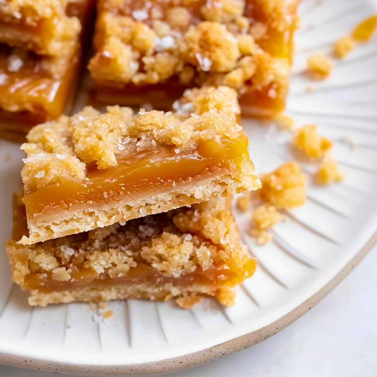 Delicious salted caramel butter bars, garnished with a pinch of sea salt.