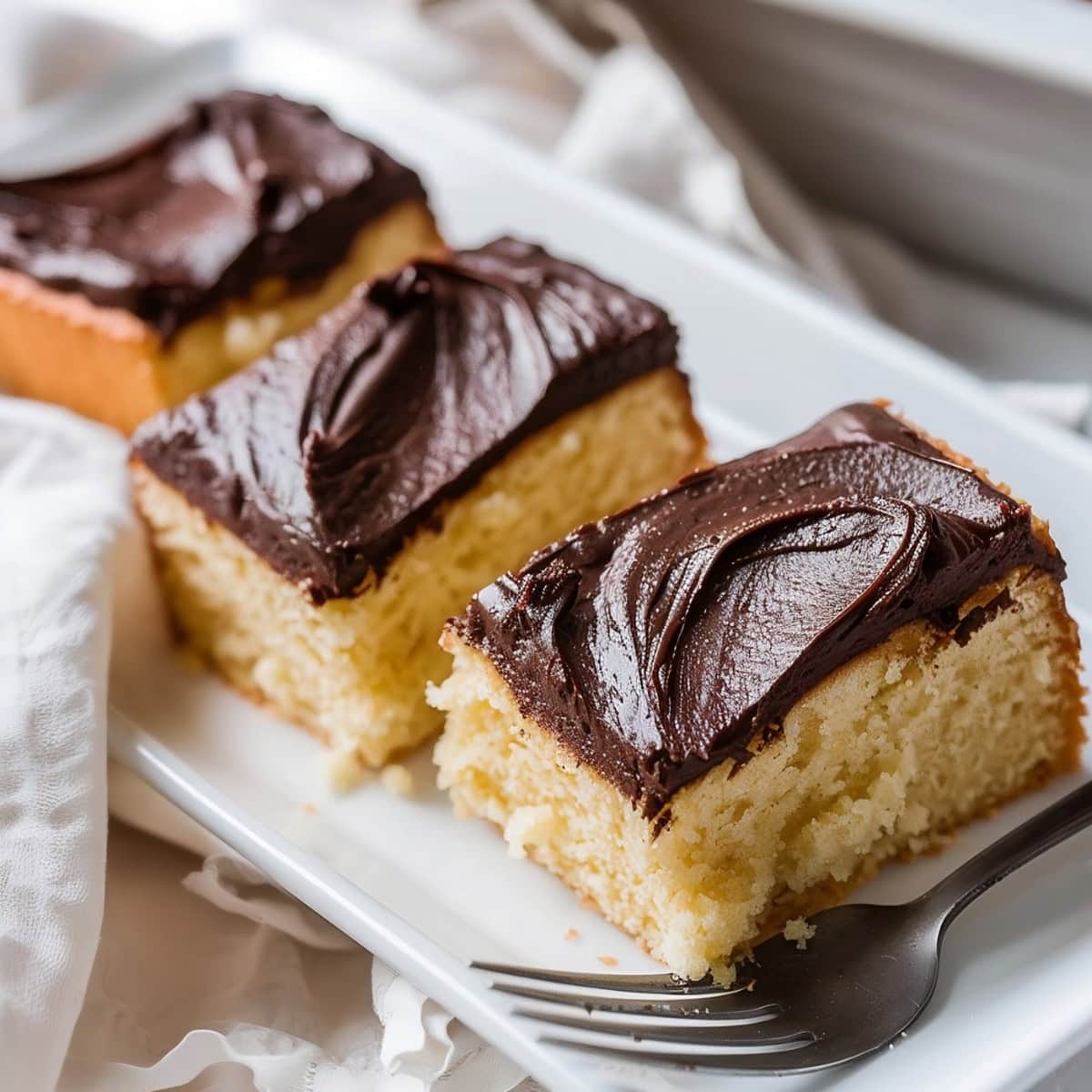 Three Yellow Sheet Cake with Chocolate Frosting