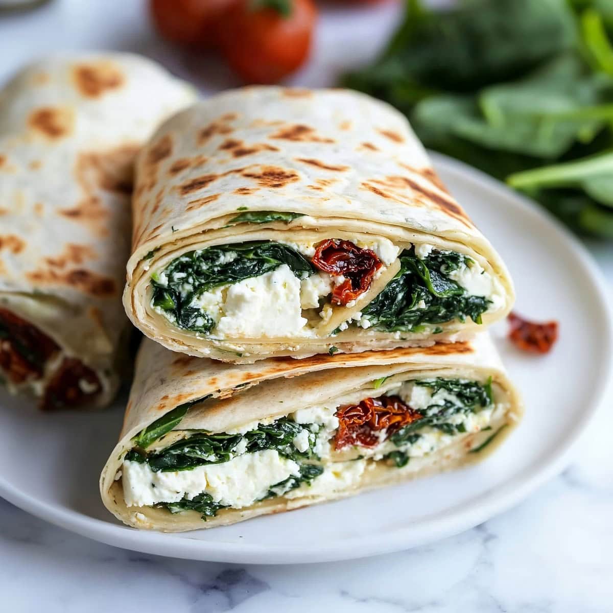 Perfectly wrapped copycat Starbucks spinach feta wrap ready to eat.