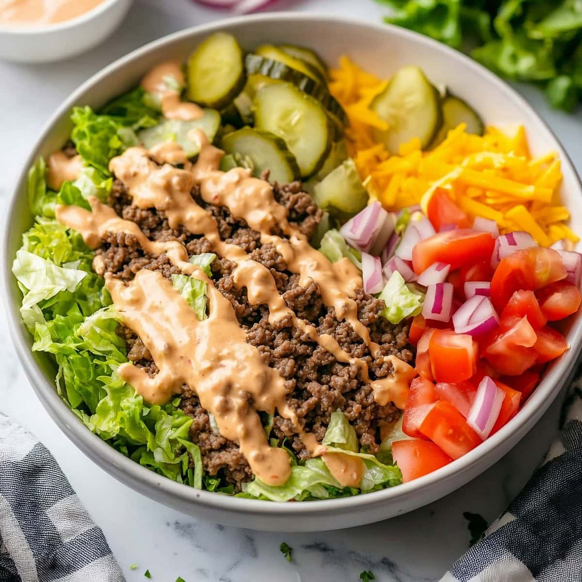 Big Mac Bowl with Ground Beef, Vegetables and Cheese, Drizzled with Mayo.