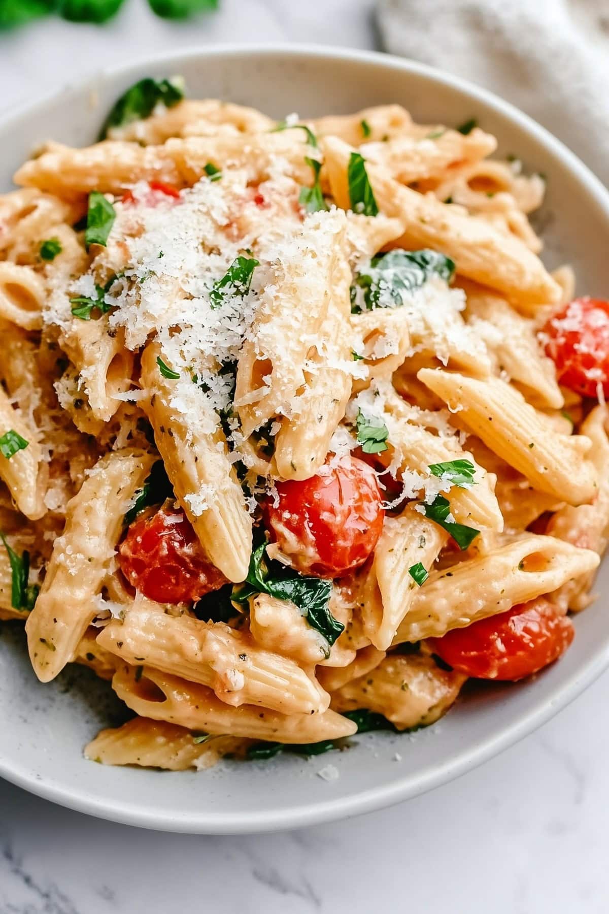 Boursin cheese pasta with a rich and creamy texture in a plate.