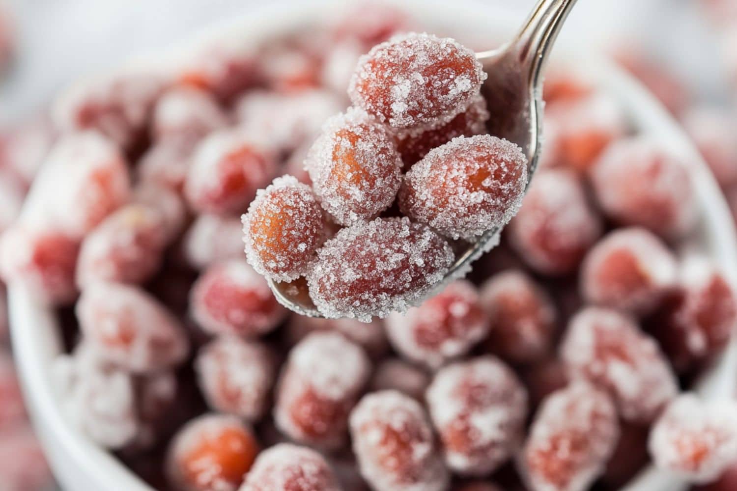 Spoonful of sugar coated candied peanuts.