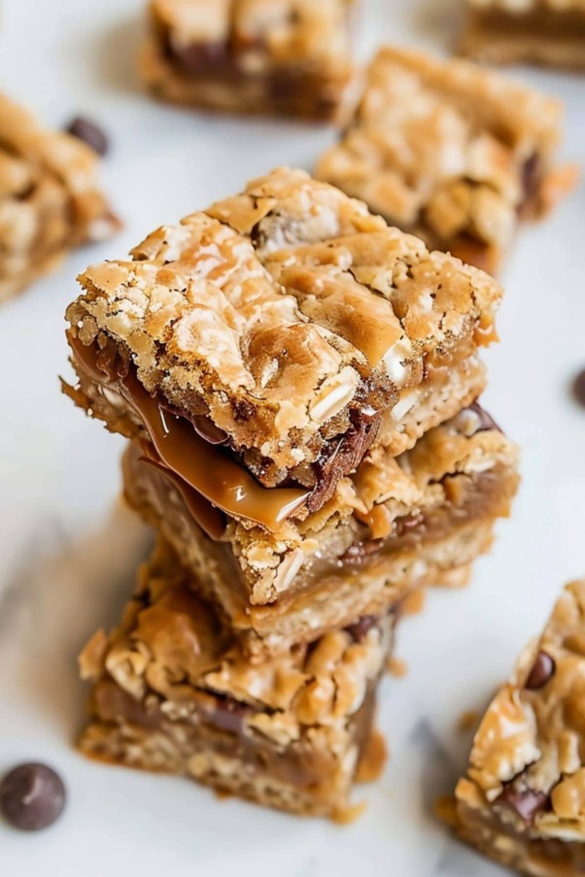 Square slices of carmelitas stacked on top of each other.