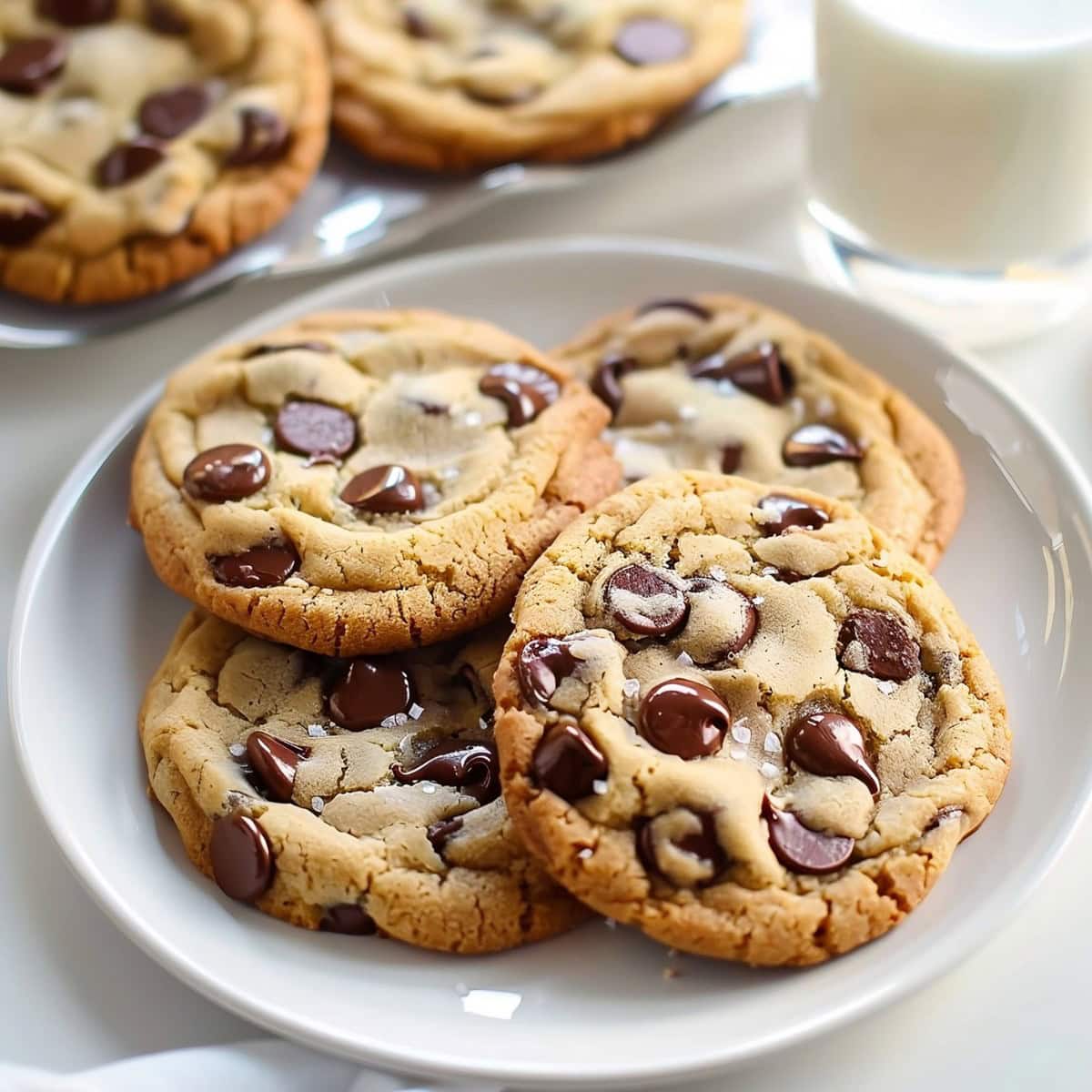 Chocolate Chip Pudding Cookies on a White Plate Served with Milk.