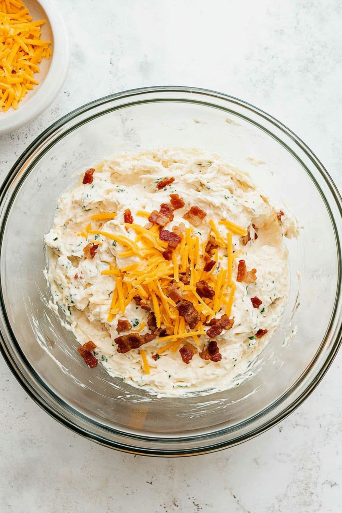 Creamy chicken mixture in a glass bowl. 