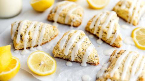 A warm lemon poppyseed scone with a drizzle of icing