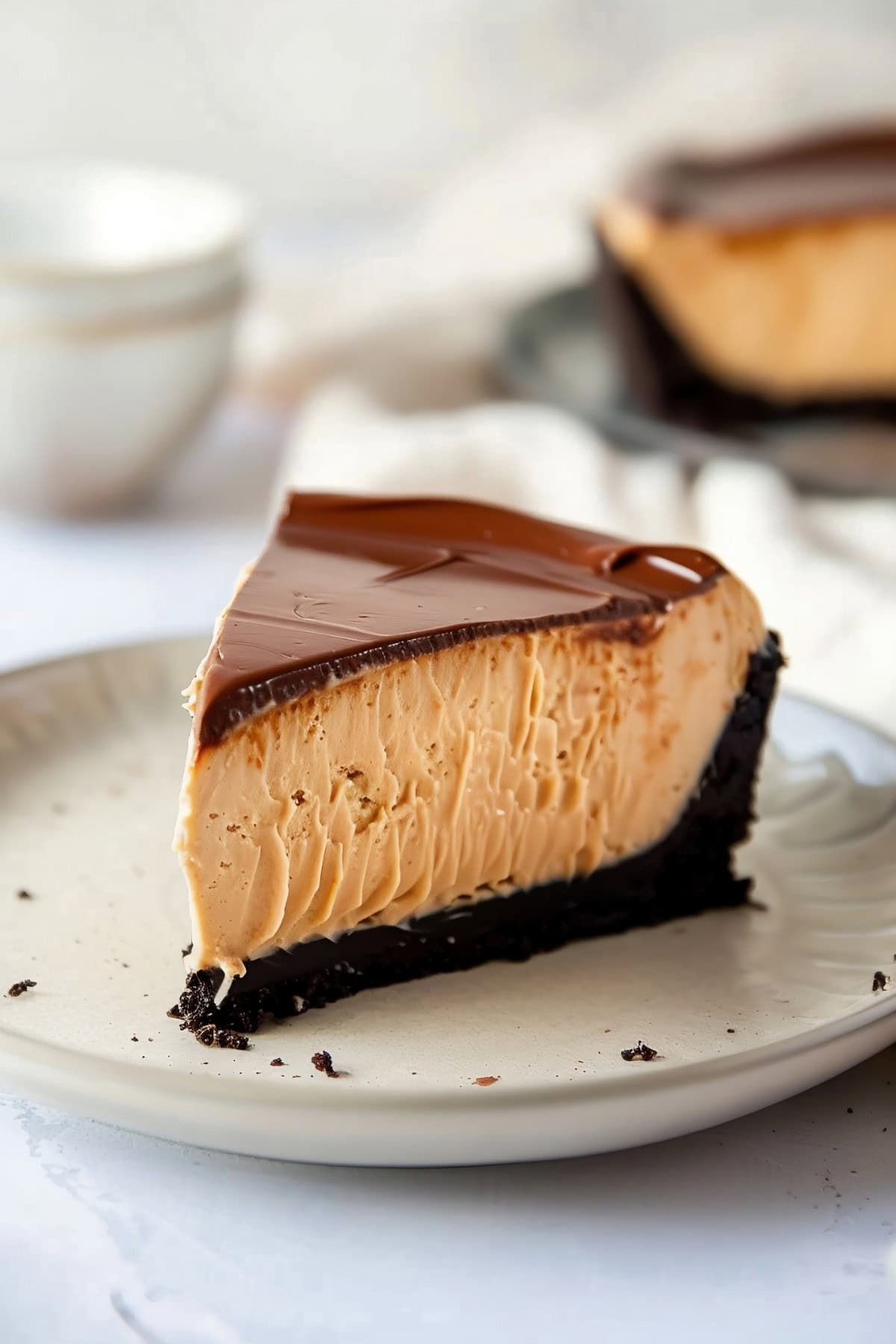 Creamy peanut butter cheesecake with a chocolate ganache topping.