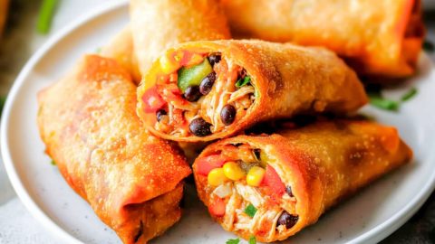 Southwestern egg rolls in a white plate.