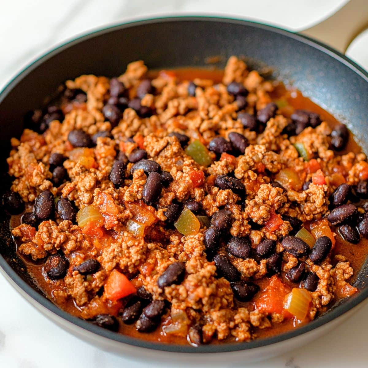 Taco beef filling in a skillet pan.