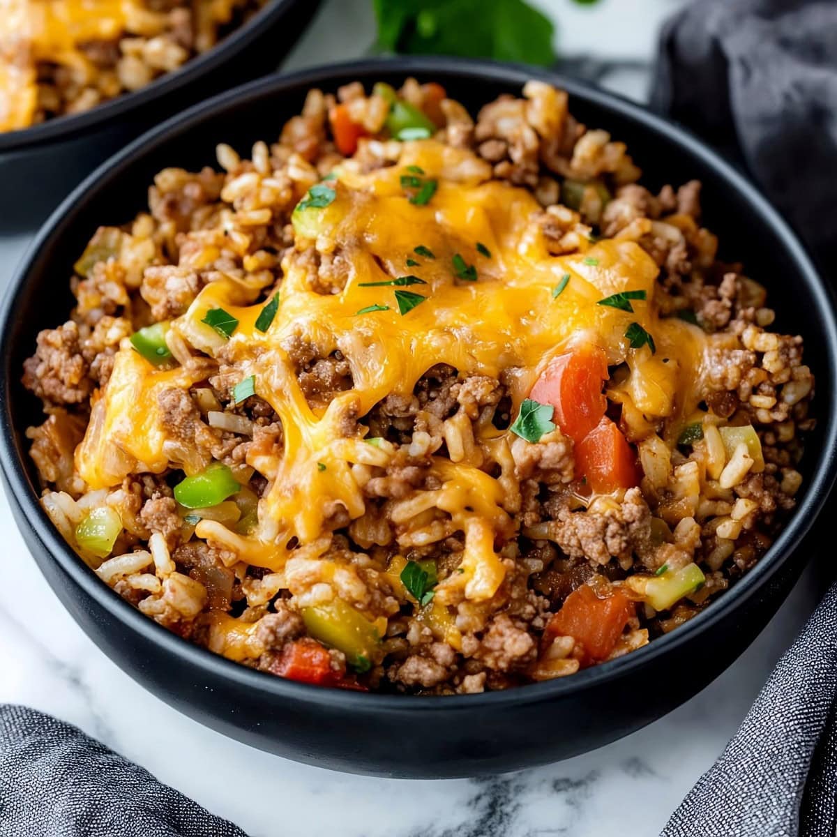 Texas hash with beef and vegetables in a black bowl.