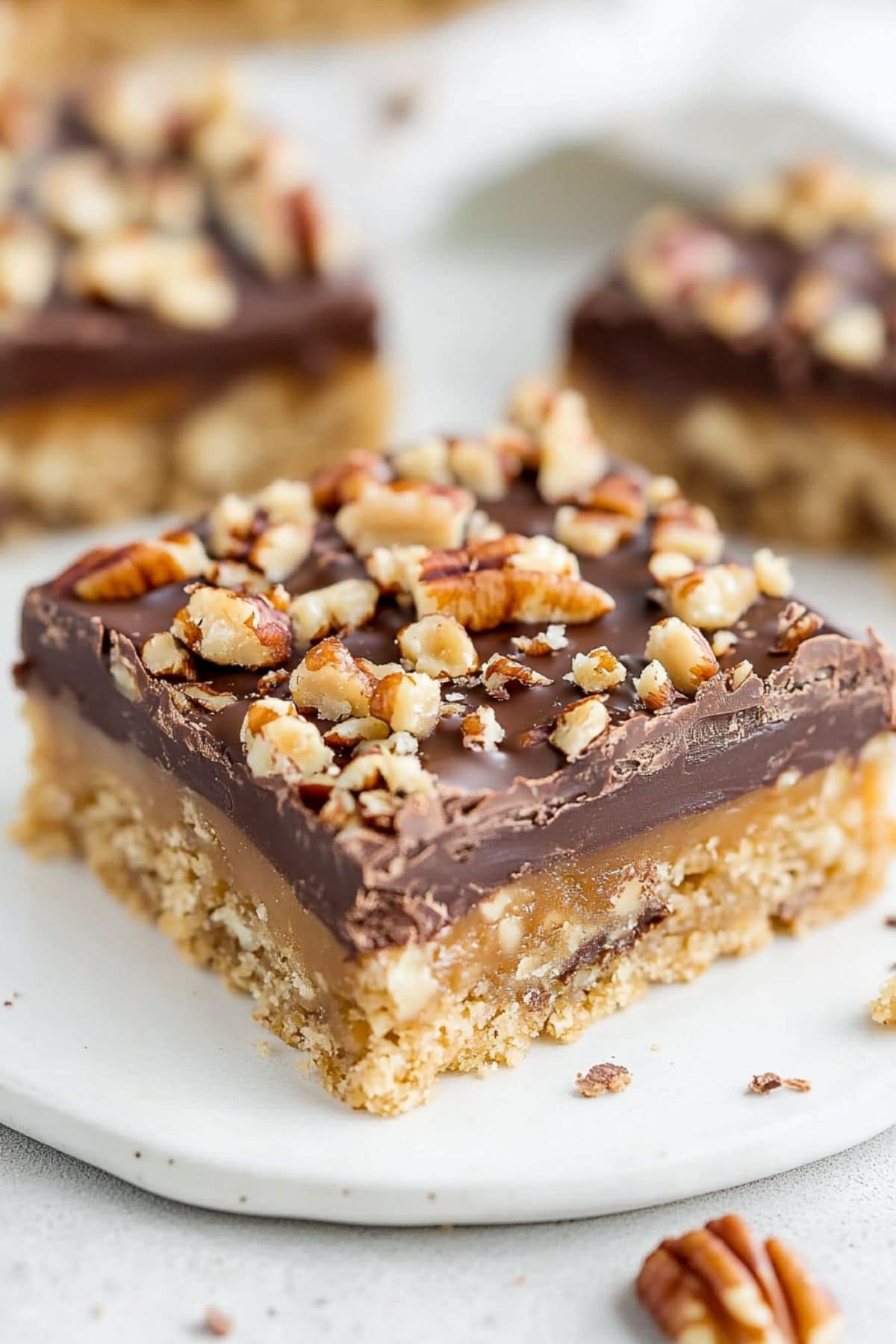 Toffee bar slice on a white plate, close up