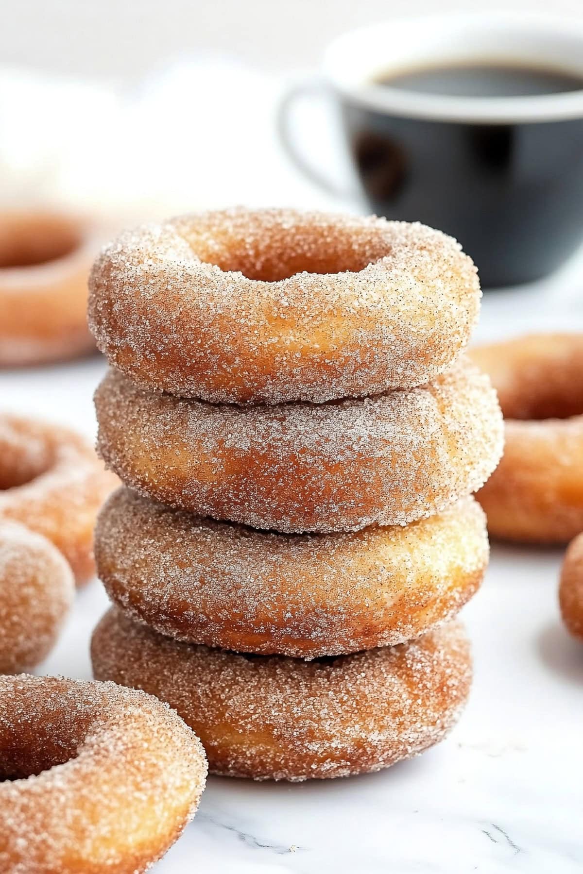 A stack of canned biscuit donuts, side view