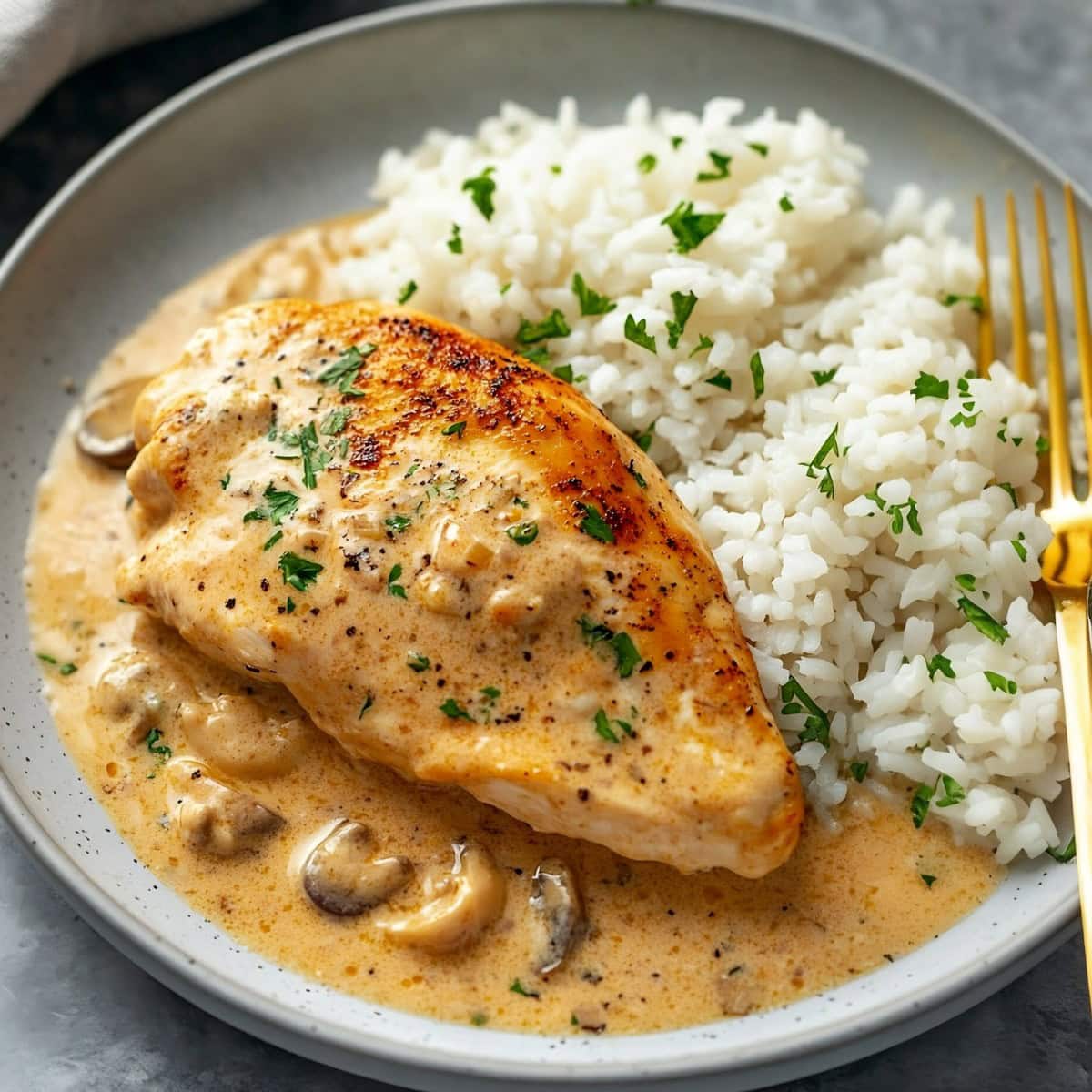 Creamy chicken diane served with rice.