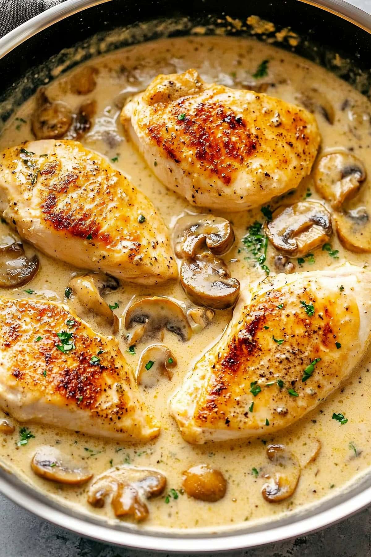 Easy Creamy Chicken Diane with Sauce in a Skillet, Overhead View.